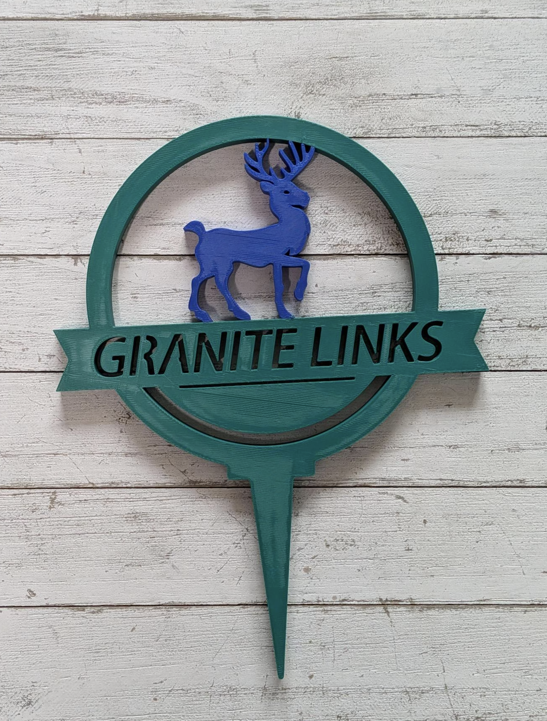 Green and blue Granite Links golf sign with a deer emblem
